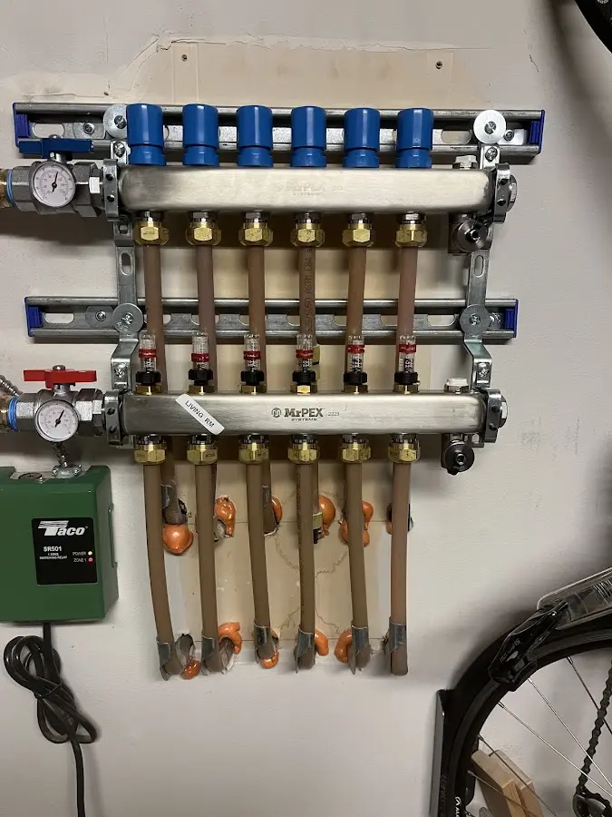 Plumber performing Gas Leak Detection at a residential property in Ashwaubenon